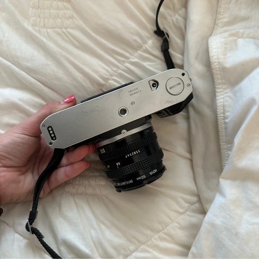 Canon AE-1 35mm Film Camera in Silver and Black with Lens